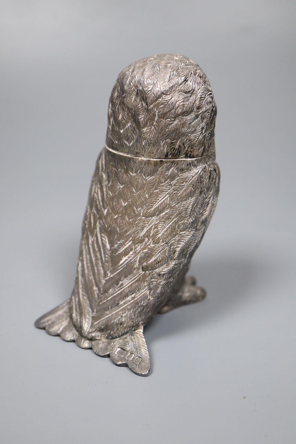 A 1970s novelty silver pepperette, modelled an owl with glass eyes, Edward Barnard & Sons Ltd, London, 1972, 11.3cm,